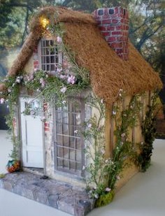 Toy house with straw roof made of coconut fiber 02