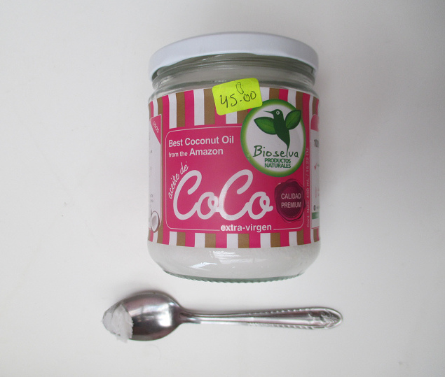 Coconut oil
                          from the Amazon, the glass with etiquette, and
                          coconut oil (coconut oil) on the spoon, bought
                          in a bio-pharmacy "Kaita" in Lima