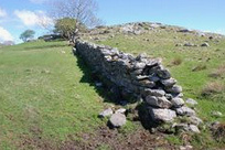 A solo dry stone wall freestanding in Norway