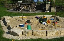 Sandpit with dry stone wall of 1 layer