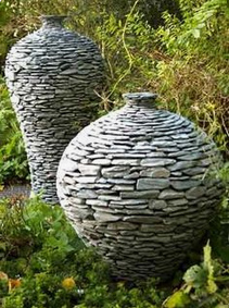 dry wall amphorae in a wild garden VERY GOOD