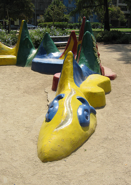 Fantasy 02: a volcano
                            snake as a bench around a palm tree in
                            Brazil Park (parque Brasil) in Santiago in
                            Chile