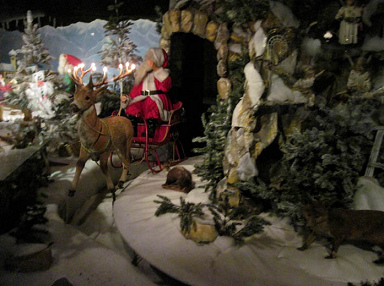Fairy tale forest in
                              Ibbenbueren 11, Santa Claus coming on a
                              sled drawn by a stag with lights on it's
                              antler (fairy tale: "Winter's
                              Tale")