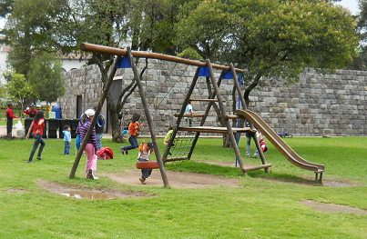 Slide with climbing possibility and
                              swings in Ejido Park in Quito, Ecuador