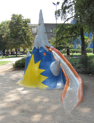 Volcano slice 03 on Brazil Square
                              (plaza Brasil) in Santiago in Chile with a
                              smiling face and a snowy top