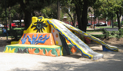 Double slide in form of a pyramid
                              slide, Brazil Square (plaza Brasil),
                              Santiago in Chile, half frontal view