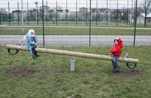 Seesaw 03 made of wood with soft
                              rubber buffers on the territory of soccer
                              club BFC Dynamo Berlin