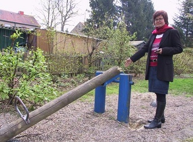 This seesaw of wood
                              on a woodchip ground was destroyed by
                              vandalism by brainless adult people,
                              Boenen, region of Dortmund, Germany