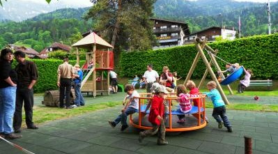 Roundabout
                            03 in Bernese Oberland with playing children
                            on it
