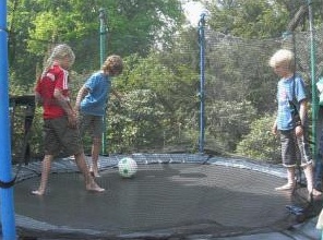 Trampoline 13: net
                            trampoline with children playing soccer in
                            the trampoline, Gladbeck, Germany