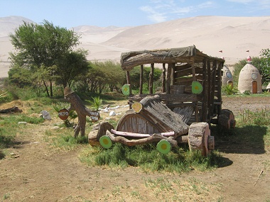 Car made of wood 01 on Hari Krishna
                              farm "Eco Truly" in Lluta Valley
                              near Arica in Chile