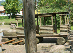 Train engine with trailer made of wood
                            on the playground of Thun, Switzerland