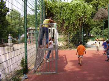 Fenced soccer field for children
                                and youths with metal goals, Reuter
                                Square in Berlin-Neukoelln