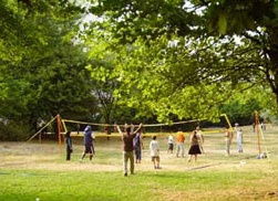 Volley ball on a lawn in Dammweg Park in
                          Berlin-Neukoelln