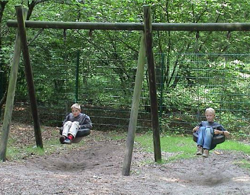 Tire
                            swing 11, children without swing, youth
                            camping at Eyll Lake, NRW, Germany